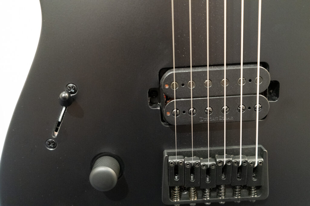 Zoom out of cracks at bridge pickup location on Solar Guitars A2.6C LH